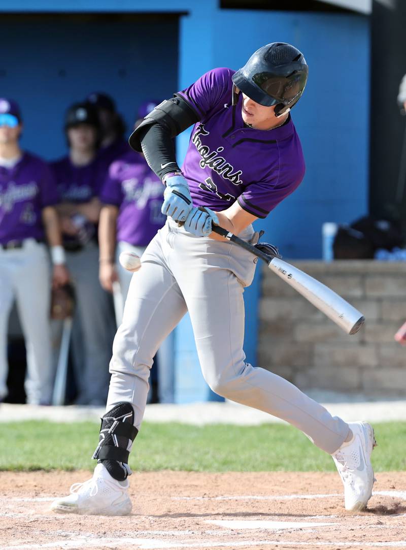 Downers Grove North's George Wolkow (24) makes contact during the boys varsity baseball game between Lyons Township and Downers Grove North high schools in Western Springs on Tuesday, April 11, 2023.