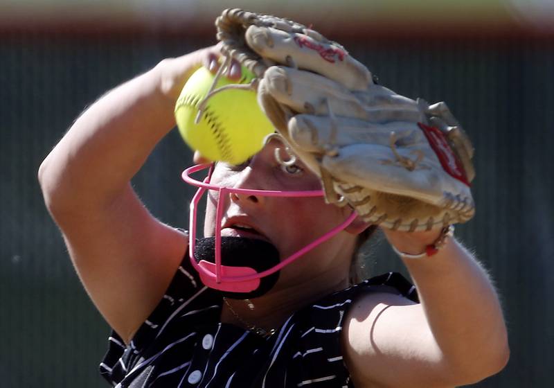 Crystal Lake Central's Oli Victorine throws a pitch during a Fox Valley Conference softball game against Prairie Ridge on Wednesday, May 14, 2025, at Crystal Lake Central High School.