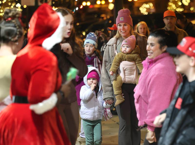 Visitors meet some of the performers from Ovation Performing Arts Studio, Friday, Nov. 21, 2025, during Moonlight Magic in downtown Sycamore.
