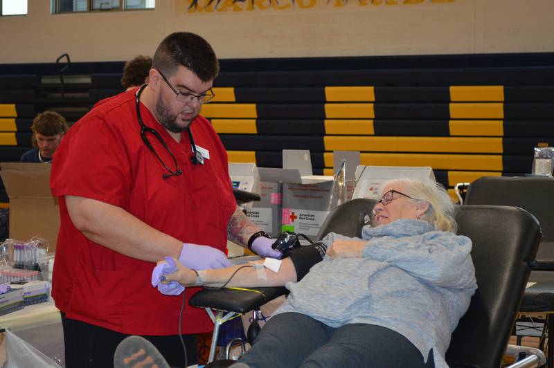 American Red Cross worker Corey Kepper talks to Judy Nettz, of Polo, while she donates blood in the Polo Community High School gym. The April 28 blood drive was hosted by the Polo Student Council.