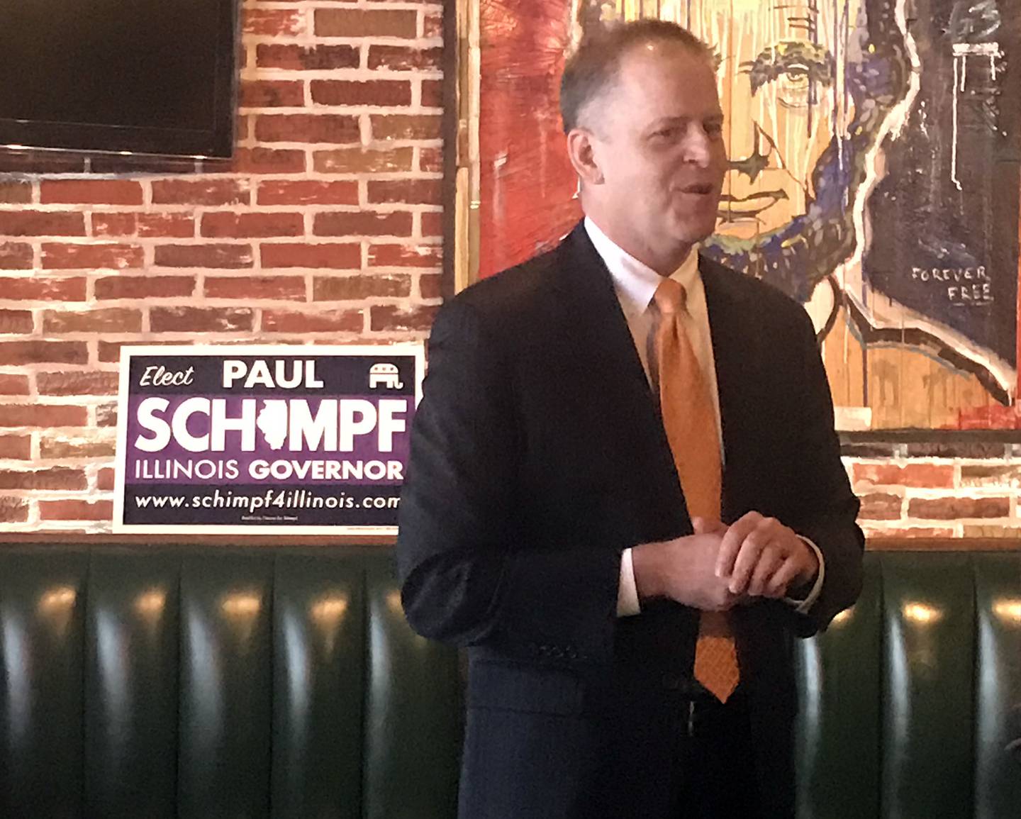 Illinois Republican gubernatorial candidate Paul Schimpf speaks to a small crowd Monday at Honest Abe's in Morris.