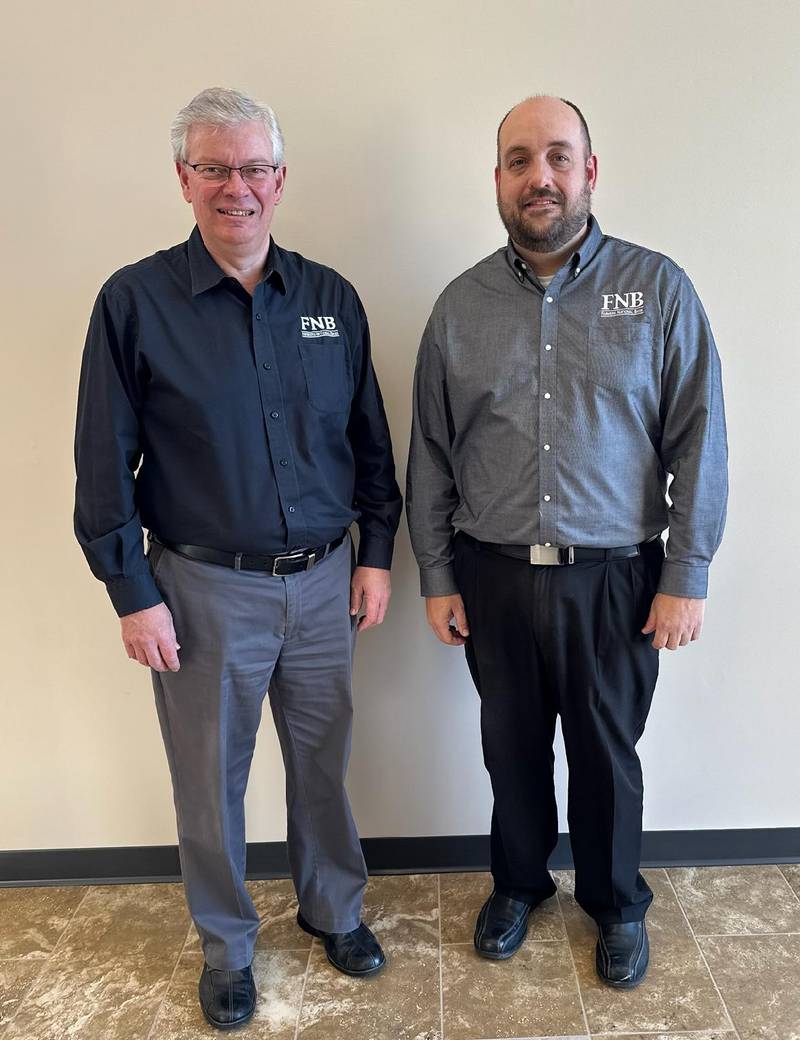 Scott VanOpdorp (right) has been appointed to the Board of Directors of Prophetstown Banking Co. and Farmers National Bank. He is shown with Farmers National Bank President Garett Plumley.