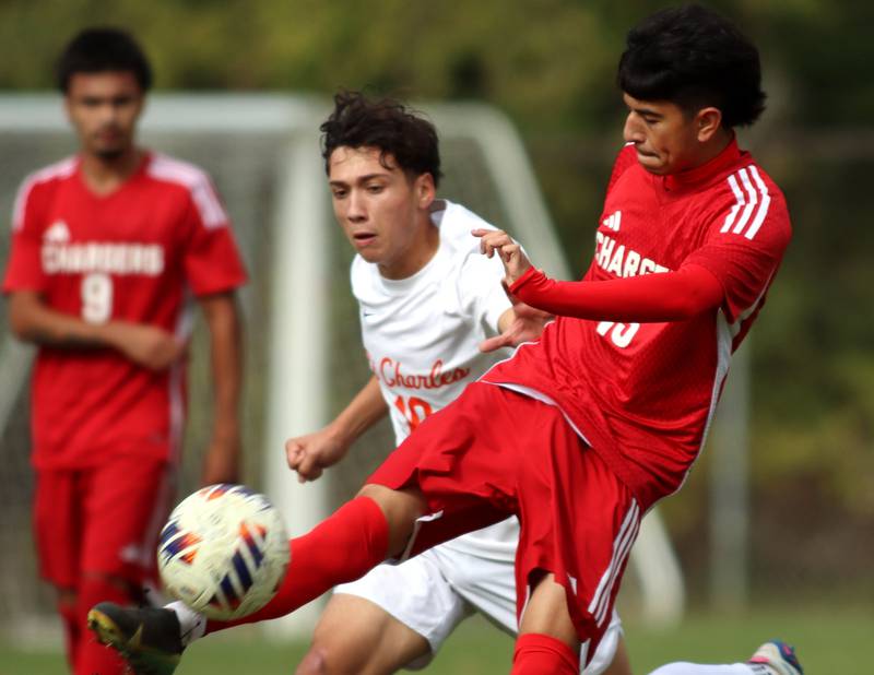 Dundee-Crown’s Sebastian Sanchez, right, tussles with St. Charles East’s Huxley Kapoor in IHSA Class 3A Regional Championship soccer at Dundee-Crown High School in Carpentersville on Saturday, October 25, 2025.