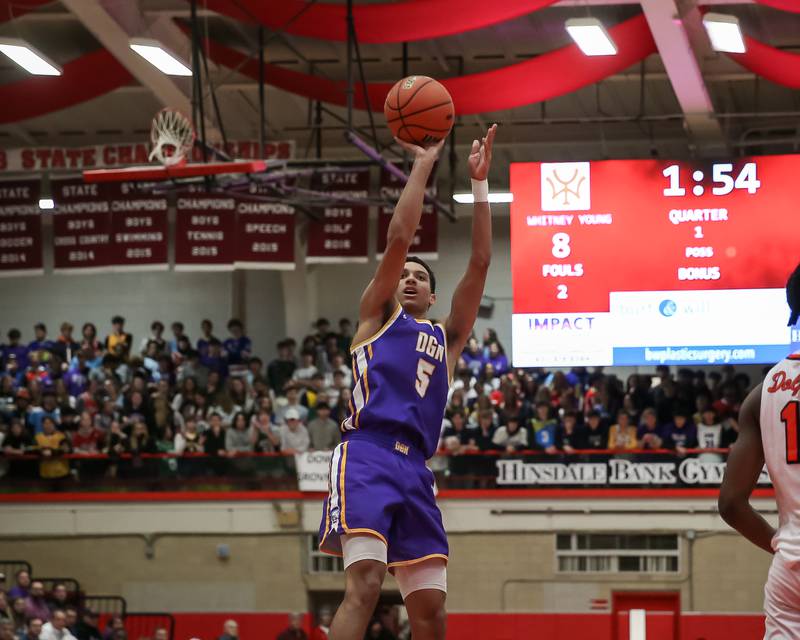 Downers Grove North's Jacob Bozeman (5) shoots a jump shot during Class 4A Hinsdale Central Sectional semifinal game between Whitney Young at Downers Grove North.  Feb 28, 2023.