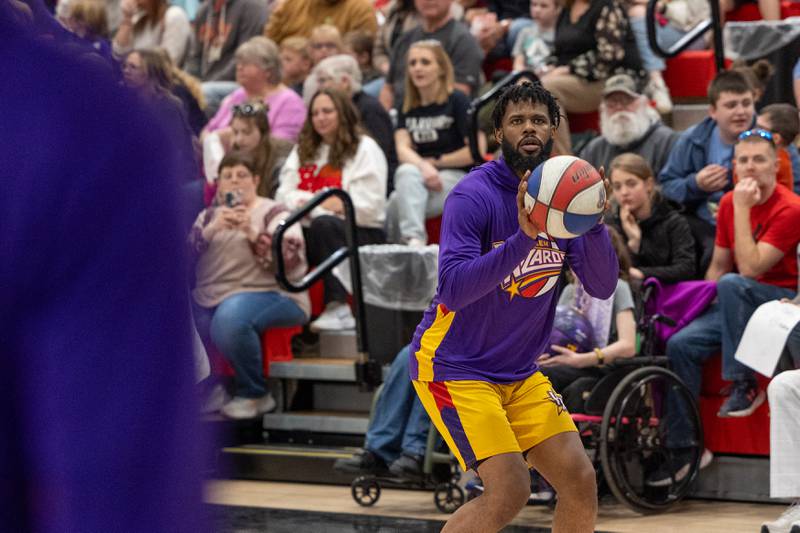 Deven “Just Do It” Dorsett (10) of the Harlem Wizards looks to shoot three pointer on Wednesday, April 16, 2025 at Woodland High School in Streator.