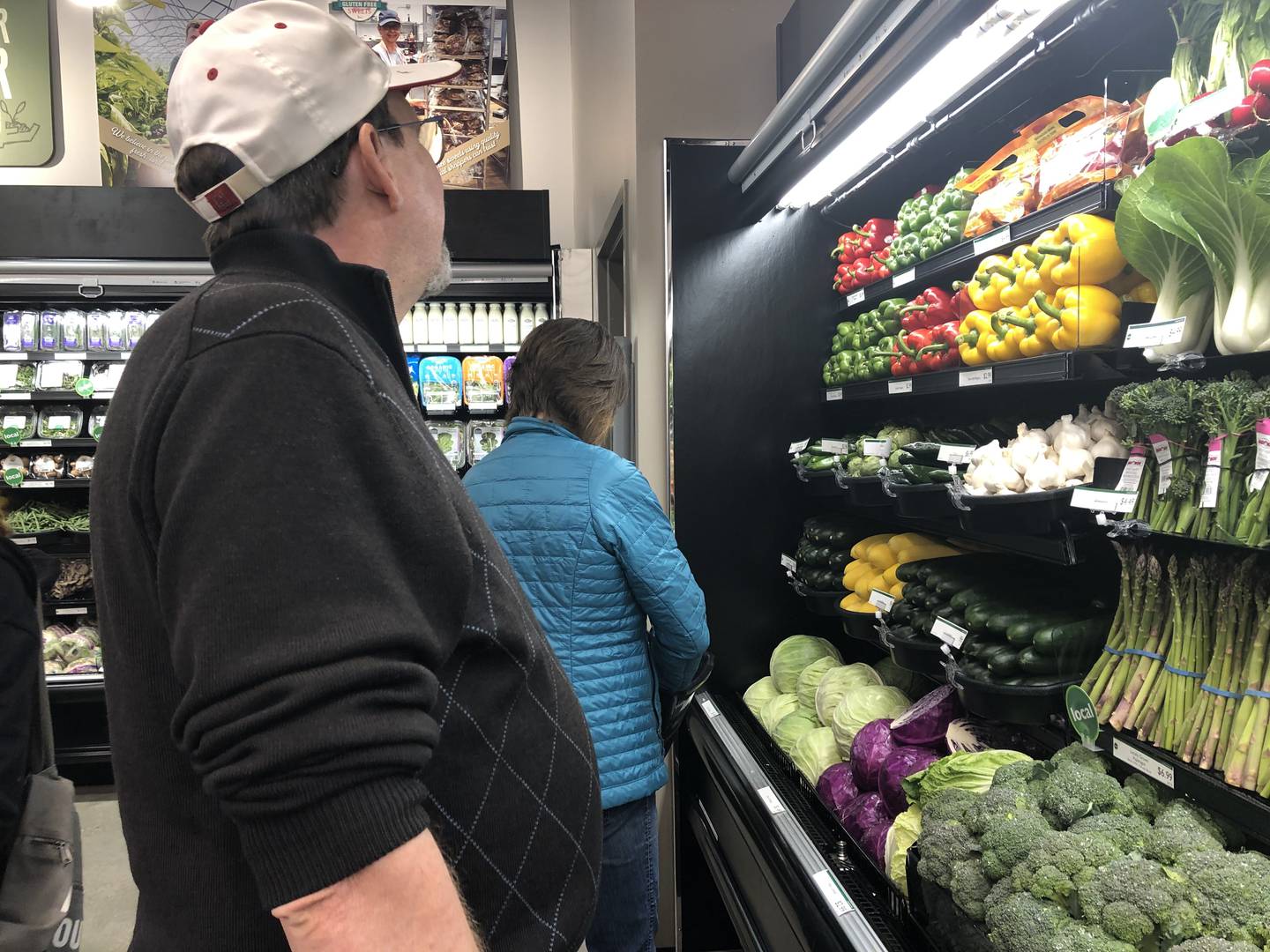 Shoppers pick out produce at the Food Shed Co-op grand opening in Woodstock May 15, 2024.