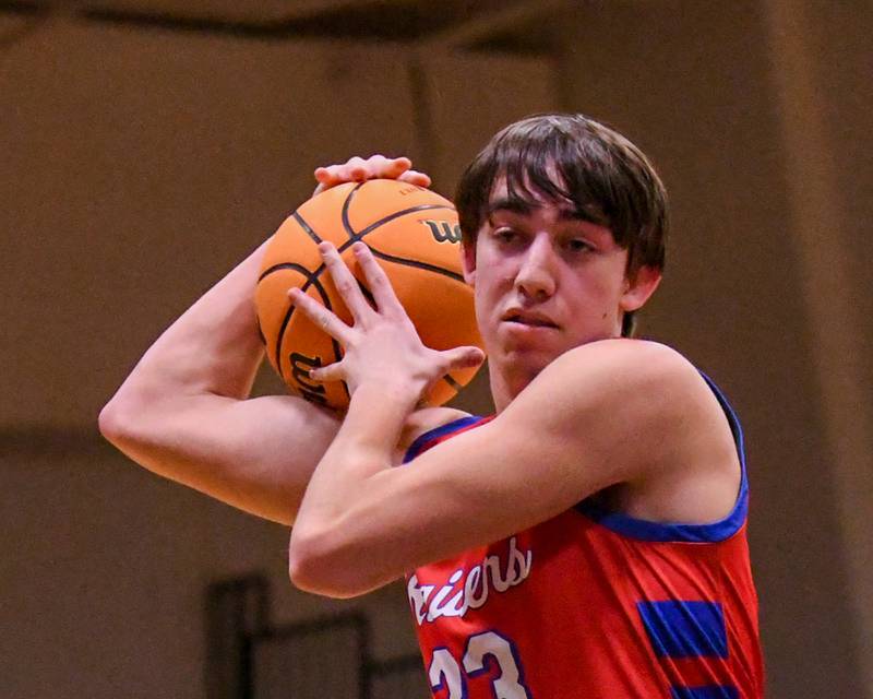 Glenbard South's Joey Villa (23) gets a rebound during the game on Friday Jan. 3, 2025, while taking on West Chicago at West Chicago High School.