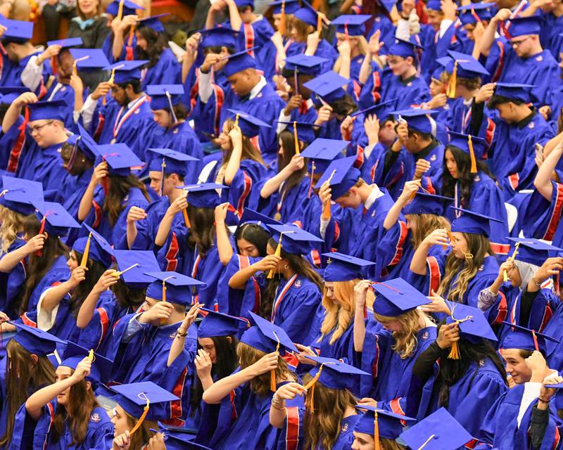 Graduates move their tassels after graduating from Glenbard South High School on Thursday May 23, 2024, held at Glenbard South High School.
