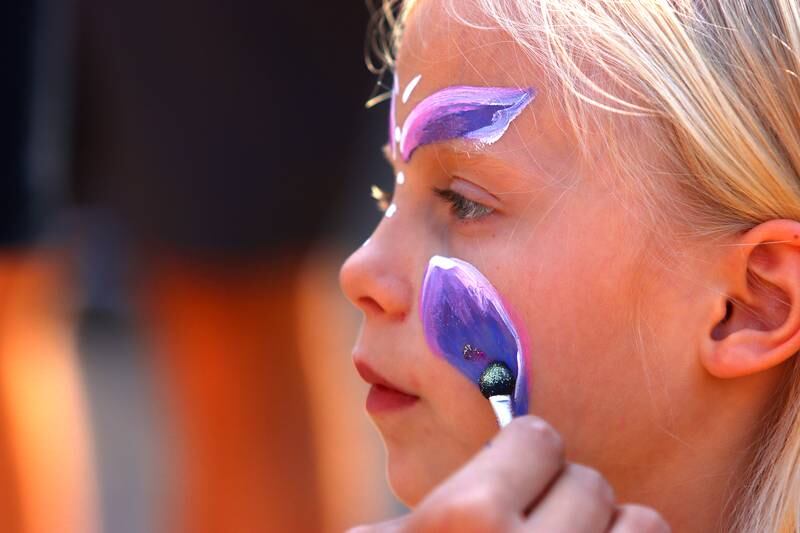 Colette  Habura, 7, of Crystal Lake has her face painted during the Johnny Appleseed Festival in Crystal Lake Saturday.