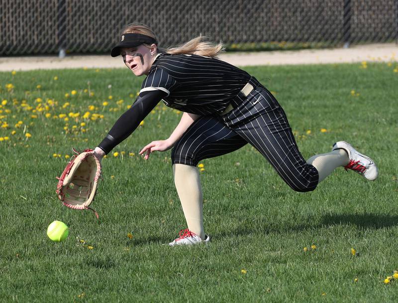 Sycamore's Ellison Hallahan can’t quite reach a DeKalb hit that would drive in three runs Friday, May 2, 2025, during their game at DeKalb High School.