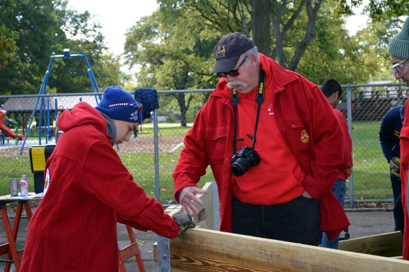 Gab Buelvas, 17, of Dixon, left, listens to Boy Scout Troop 85 Committee Chairperson Thomas Halla explain a potential challenge Buelvas needs to address in the construction of a gaga ball pit for Vaile Park on Saturday, Oct. 7, 2023. Buelvas led a group of about 15 volunteers in building the gaga ball pit as his Eagle Scout project.