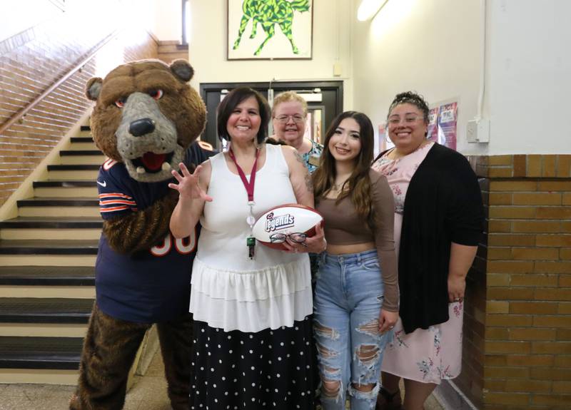 Staley Da Bear, Superintendent Dr. Theresa Rouse, Crystal Gonzalez, and A.O. Marshall Elementary School Principal Dr. Emilia Herrera pose with fifth grade teacher Maida Cornelio-Sauseda.