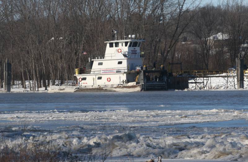 A tugboat maneuver through icy waters along the Illinois River on Tuesday, Jan. 16, 2024, near Spring Valley.