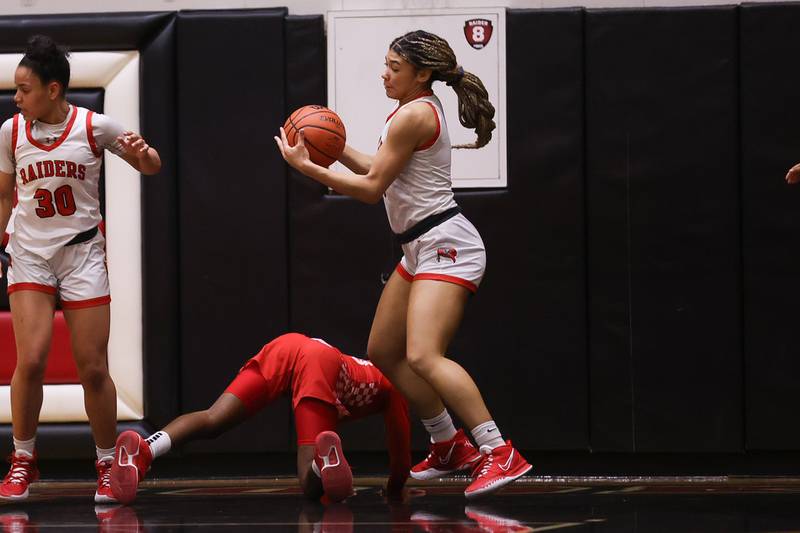 Bolingbrook’s Tatiana Thomas recovers the loose ball against Homewood-Flossmoor in the Class 4A Bolingbrook Sectional championship. Thursday, Feb. 24, 2022, in Bolingbrook.