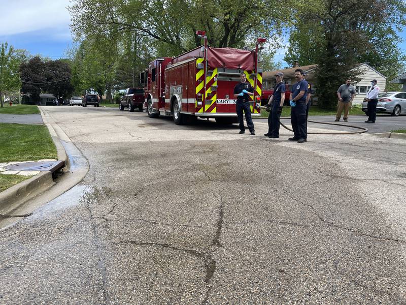 Officials from the Cary Fire Protection District visit the scene of the crash Tuesday, May 17, 2022. A three-year-old child was killed Monday, May 16, 2022, after they were hit by a school bus near the intersection of Hill Street and Cherry Street in Cary.
