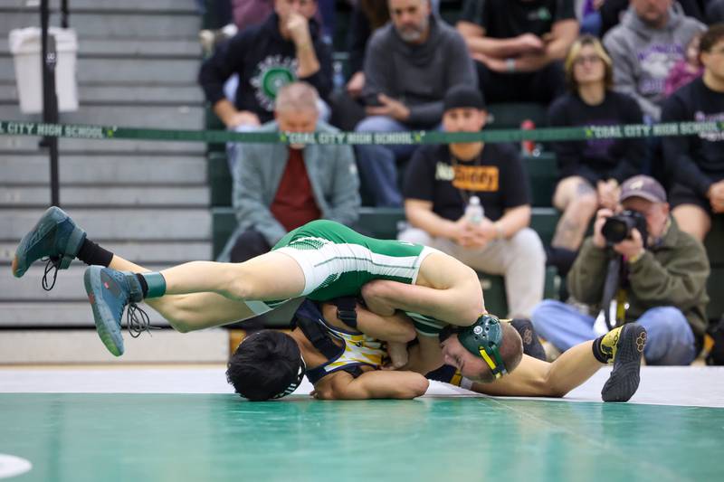 Coal City's Jake Munsterman wrestles Chicago Sullivan's Mohammed Zia Nadre in the 106-pound championship match during the IHSA Class 1A Coal City Sectional on Saturday, Feb. 14, 2026.