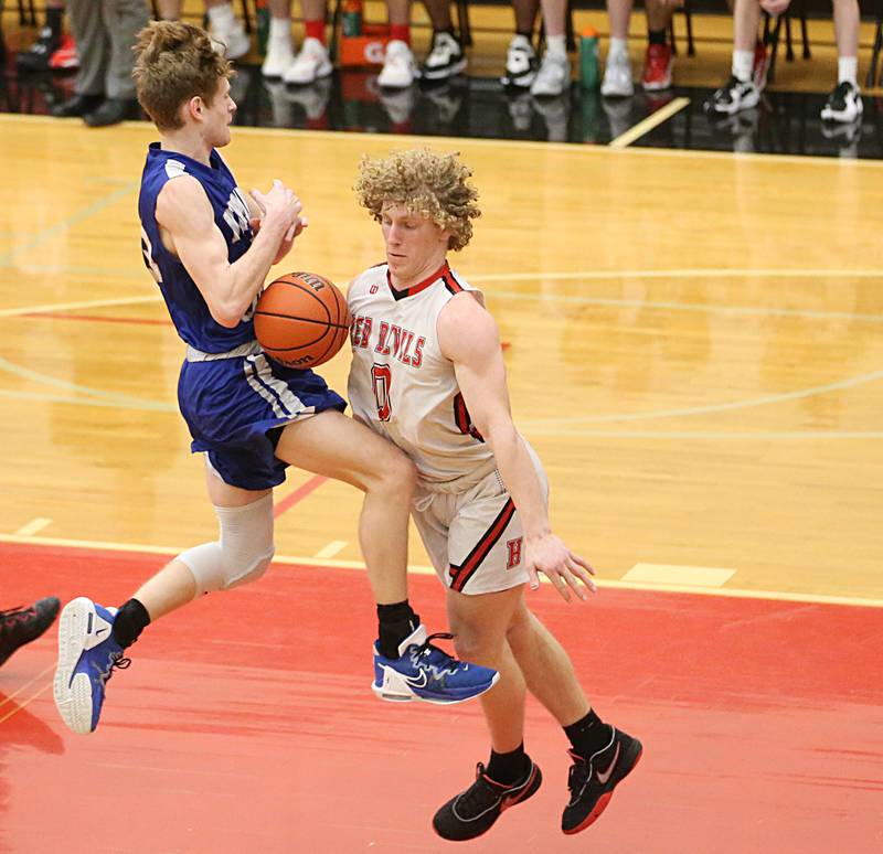 Hall's Mac Resetich draws a foul on Newman's Lucas Simpson on a drive to the hoop on Friday, Feb. 3, 2023 at Hall High School.