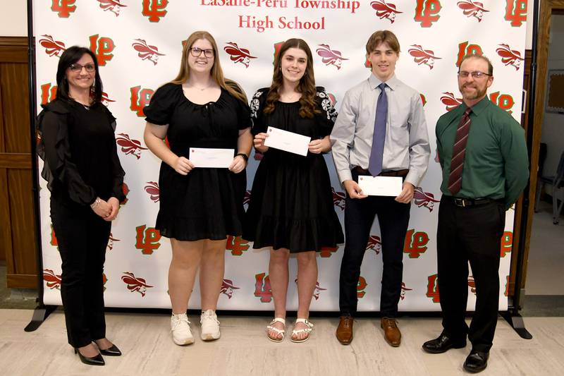 Ella Raef (starting second from left), Grace Miller and Seth Adams received the Dale Family Scholarship. These $500 scholarships, recognizing those dedicated to the betterment of society and who believe in investing in the youth, is awarded to an L-P senior who demonstrates a desire to make a difference in the world with plans to attend a two- or four-year university or trade school. The scholarship was presented by Rodney (right) and Rici Dale (left).