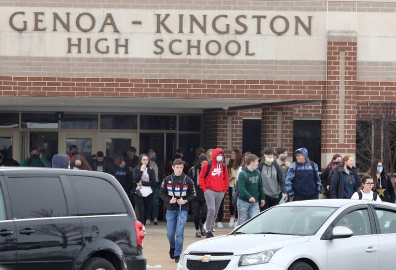 Genoa-Kingston High School students exit the building Tuesday, Jan. 19, after the first day back for in-person classes since the school was closed earlier this school year due to the COVID-19 pandemic.