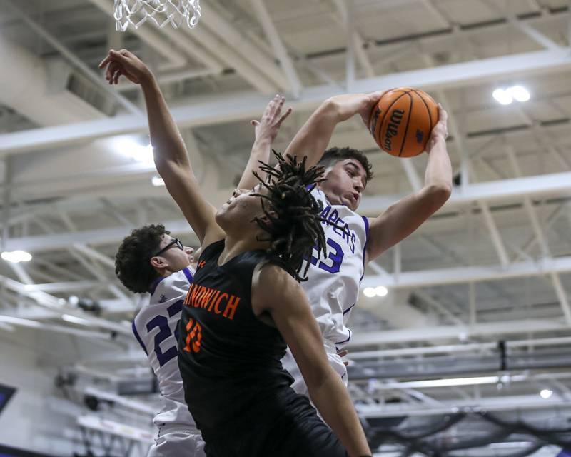 Plano's Cooper Beaty (23) grabs a rebound during their basketball game between Sandwich at Plano Tuesday, Dec 9, 2025 in Plano.