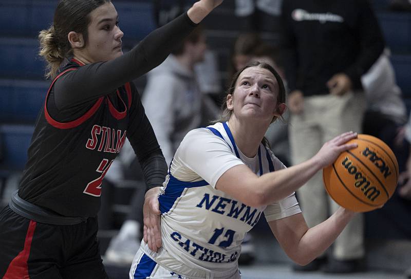Newman’s Lucy Oetting looks to put up a shot against Stillman Valley’s Emma Withers Monday, Feb. 2, 2026.