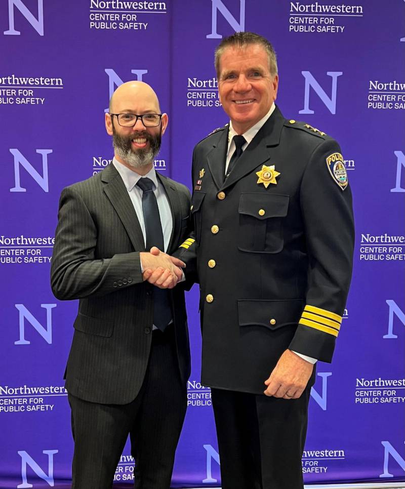 Village of Montgomery Police Department Detective Sergeant Greg Mayyou, left, pictured with Montgomery Chief of Police Phillip J. Smith at the Northwestern University Graduation Ceremony.