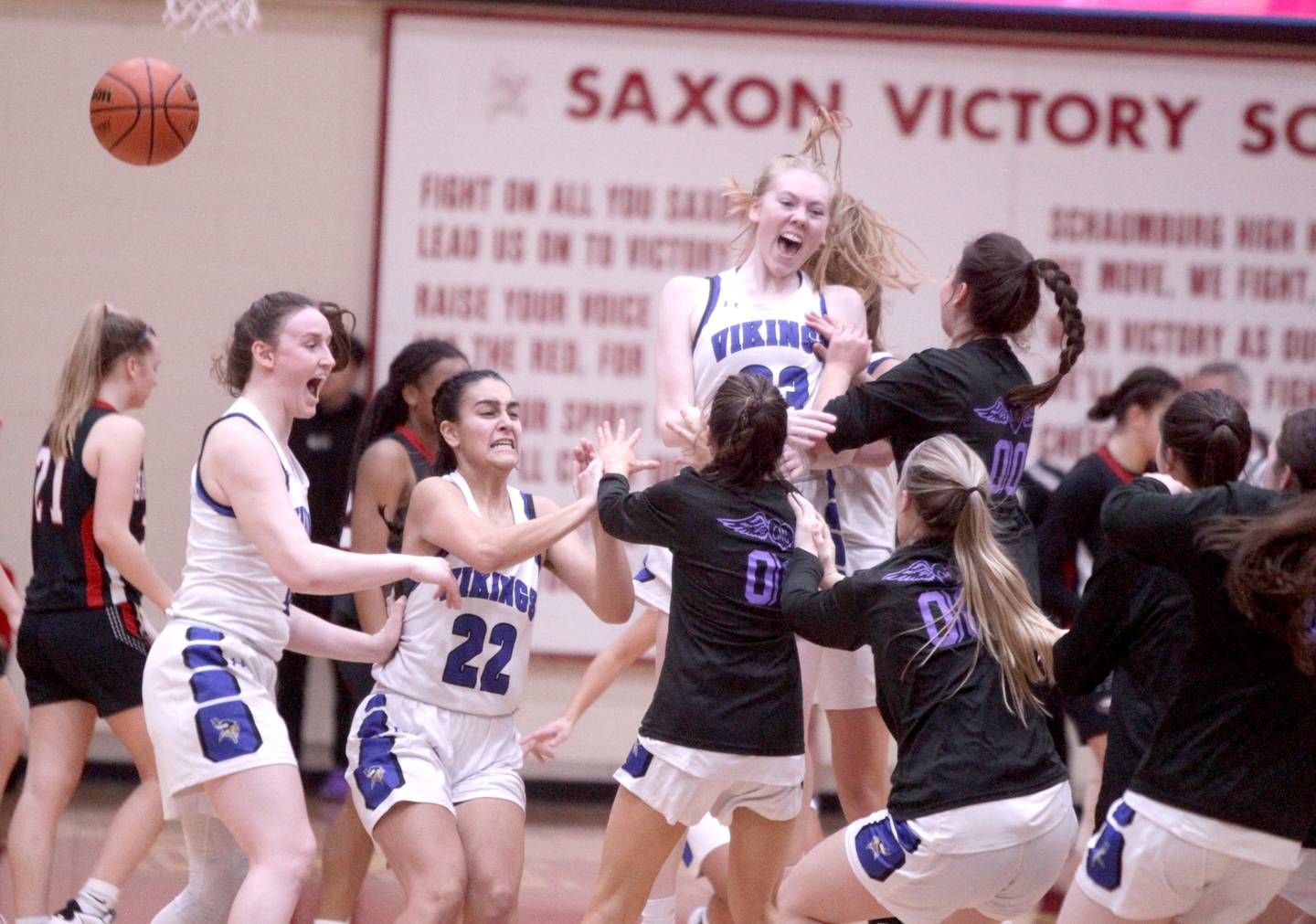 Geneva players including Cassidy Arni (far left), Leah Palmer (second from left) and Lauren Slagle celebrate their Class 4A Schaumburg Supersectional win over Barrington on Monday, Feb. 27, 2023.