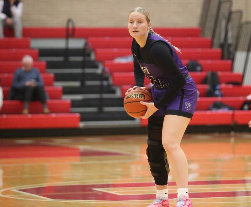 Dixon's Jessie Pitman looks to pass the ball against Ottawa on Wednesday, Nov. 29, 2023 at Kingman Gym.
