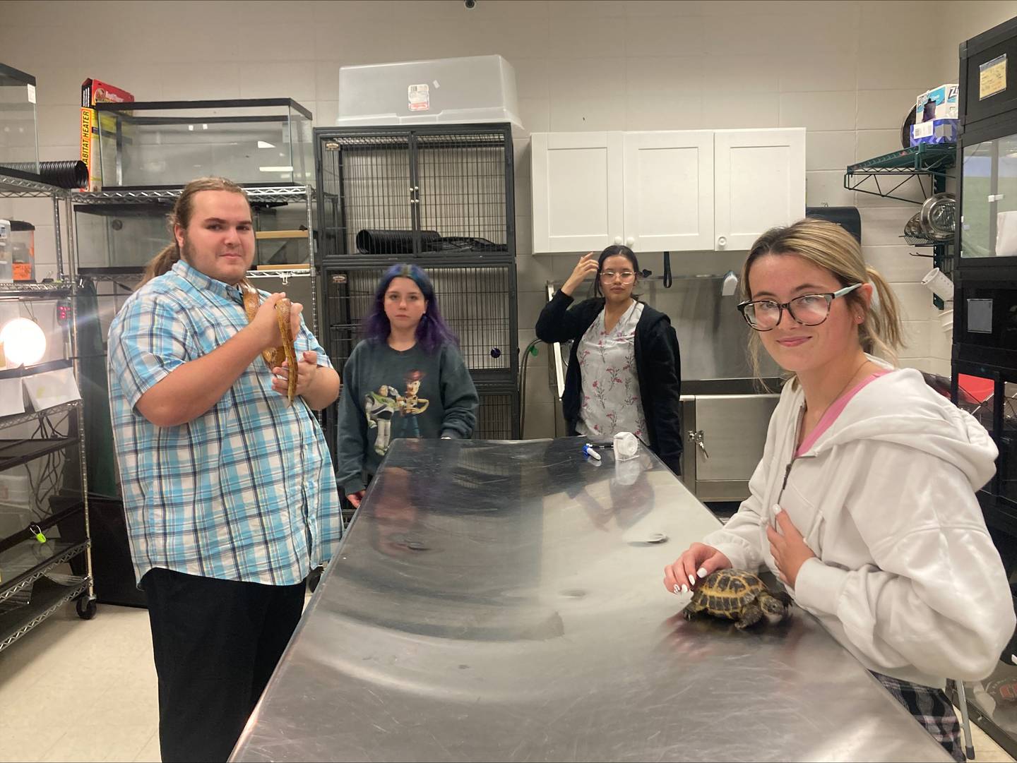 Wilco Veterinary Assistant Students Martin Gonda and Faith Haars handle corn snake, Carlton and Russian tortoise, Jackson.