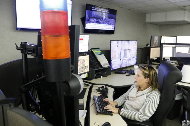 SEECOM telecommunicator Lisa Mattson works the phones and computer systems that connect 911 calls to first responders on Wednesday, Dec. 22, 2021, at Aaron T. Shepley City Hall in Crystal Lake.
