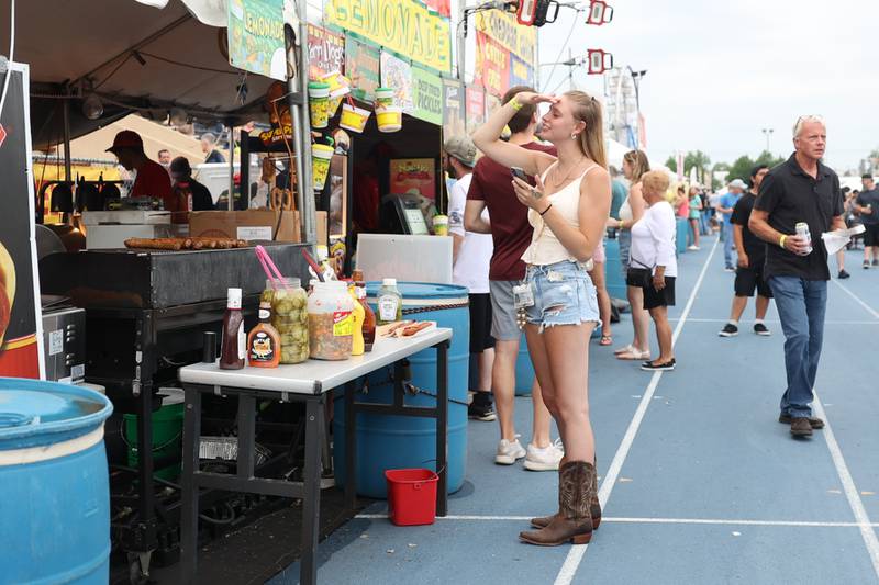 A lady waits for her food on day 2 of the Taste of Joliet. Saturday, June 25, 2022 in Joliet.