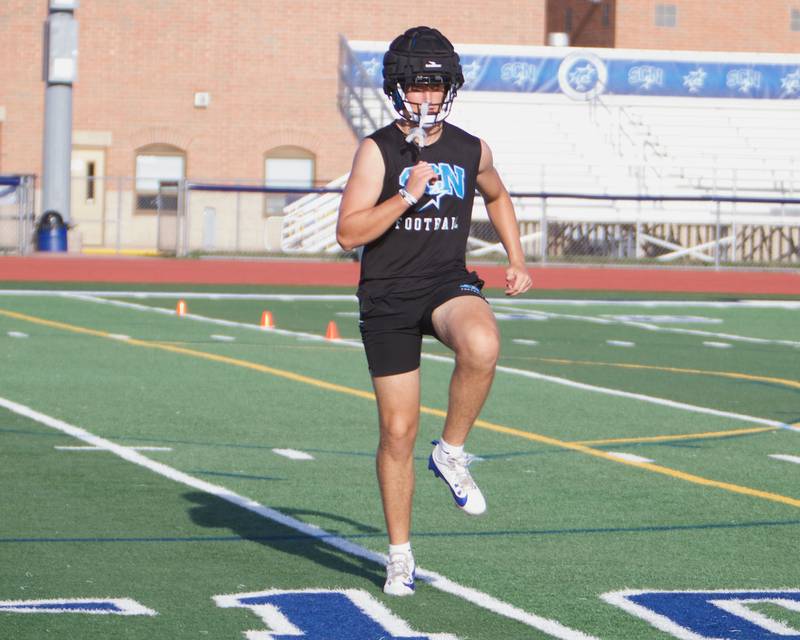 St. Charles North's Lucas Tenbrock does stretching at the first practice on Monday, Aug.11,2025 in St. Charles.
