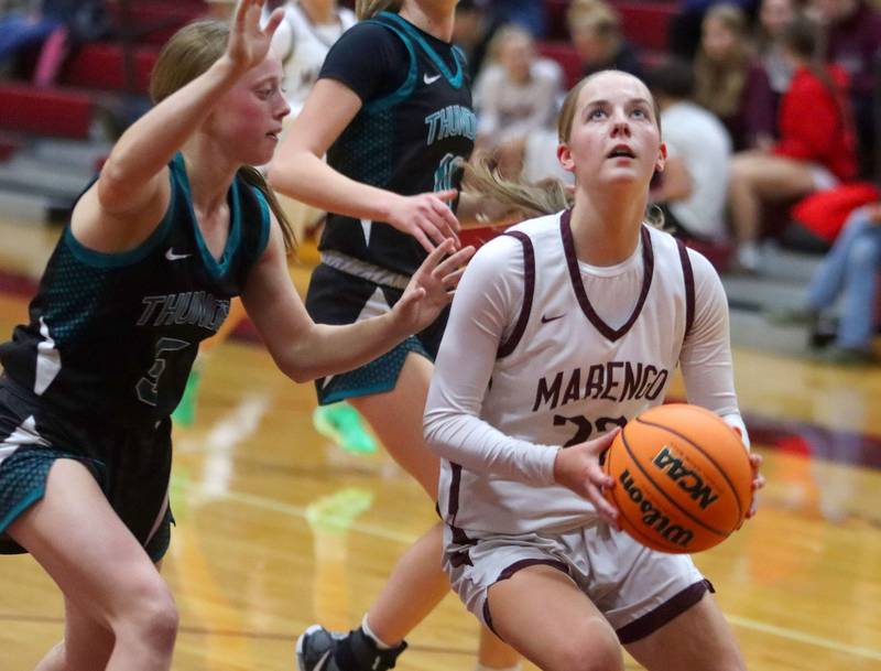 Marengo’s Sophie Hanson works under the hoop against  Woodstock North in varsity girls basketball on Tuesday, Dec. 2, 2025, at Marengo High School in Marengo.