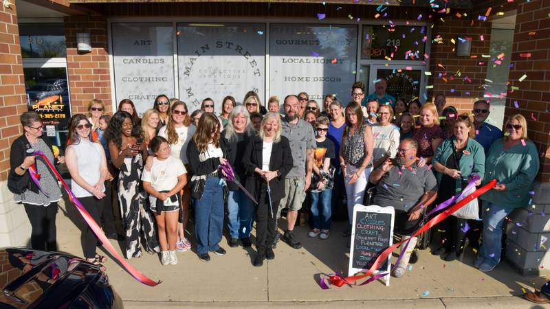 Owner Andie Groff celebrates a ribbon-cutting ceremony for her new collective boutique, Main Street Merchants, in Plano, with the Plano Area Chamber of Commerce and the Yorkville Area Chamber of Commerce on Oct. 1.