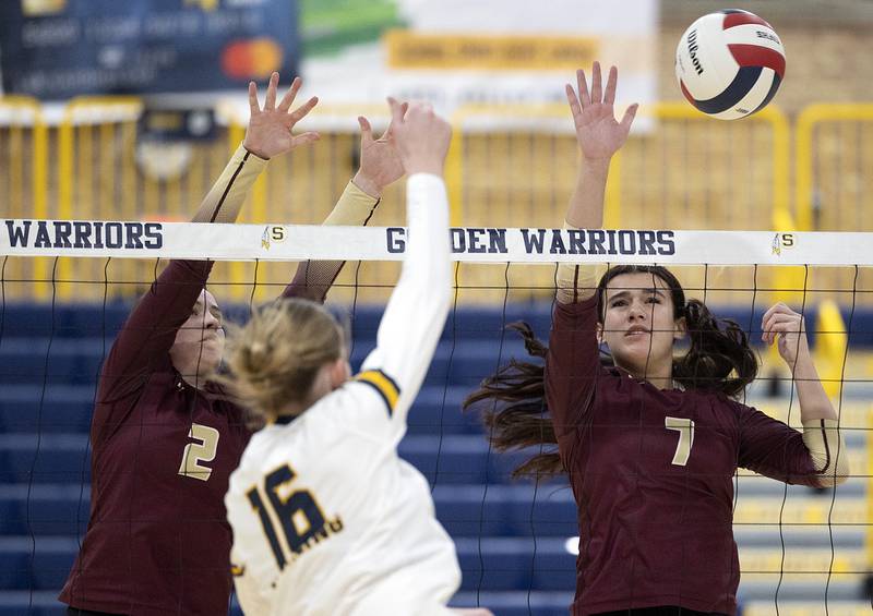 Morris’ Alexis Williams (left) and Rosemary Miesener go for a block against Sterling’s Kasey Weeks Thursday, Oct. 30, 2025, in the Class 3A volleyball regional.