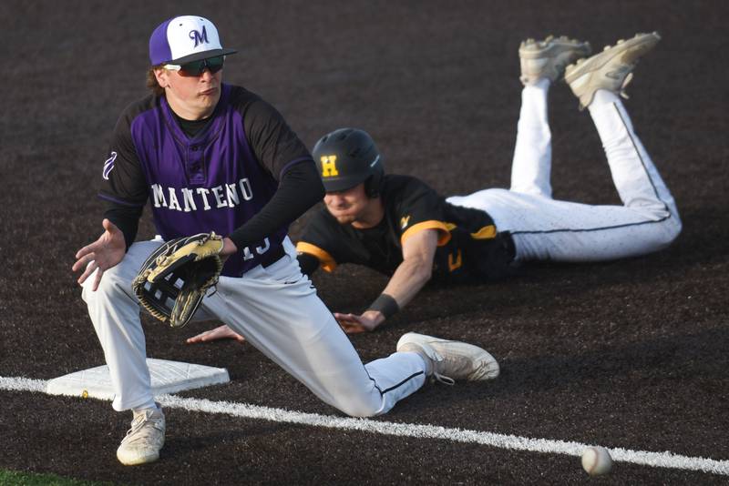 Manteno's Maddox Toepper, left, fields a throw at third base as Herscher's Tanner Jones dives in behind him for a stolen base during a game at Herscher Monday, May 11, 2026.