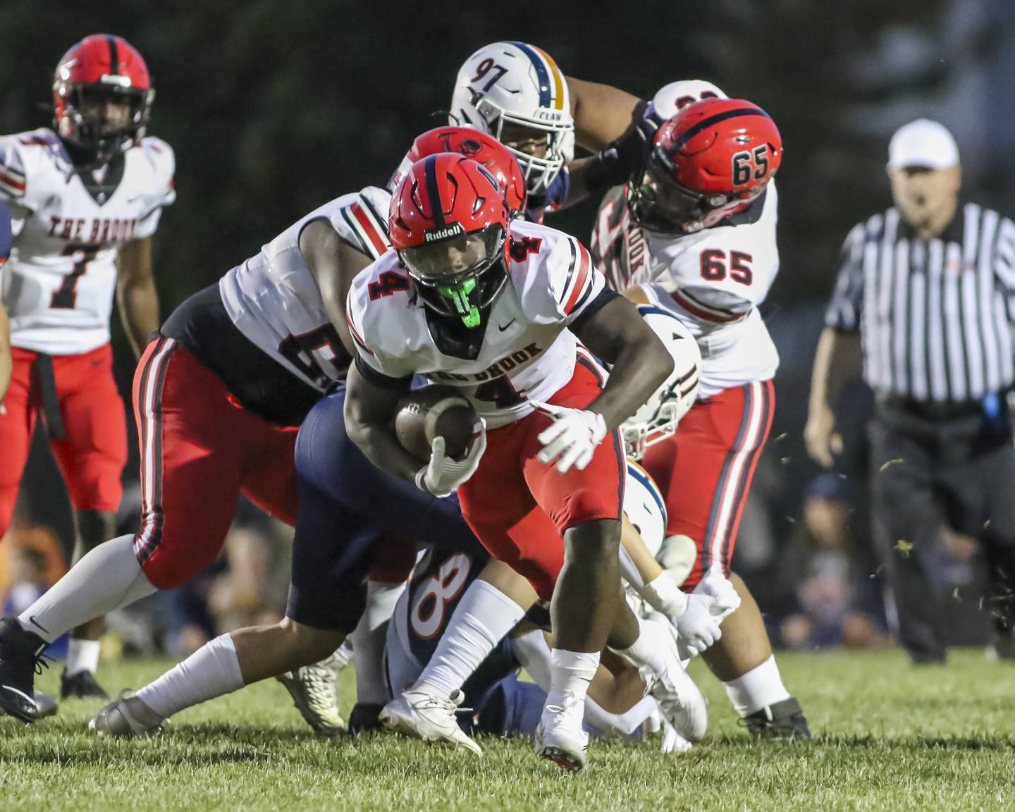Bolingbrook's Timmie Lewis II (4) runs up the middle to start off the football game between Bolingbrook at Oswego Friday, Sept 12, 2025  in Oswego.