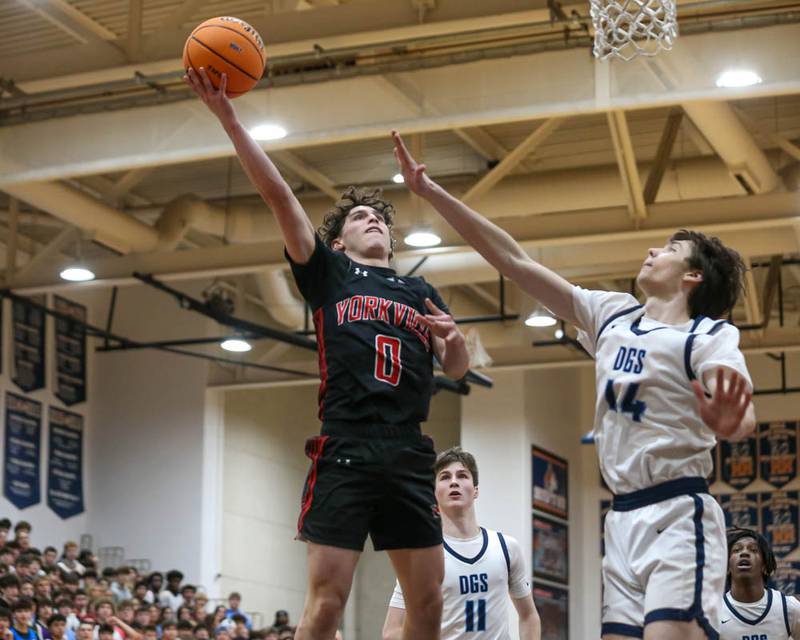 Yorkville's Gabe Sanders (0) puts up a shot at the basket during their Class 4A Naperville North Regional final basketball game between Yorkville at Downers Grove South, Feb 27, 2026 in Naperville.