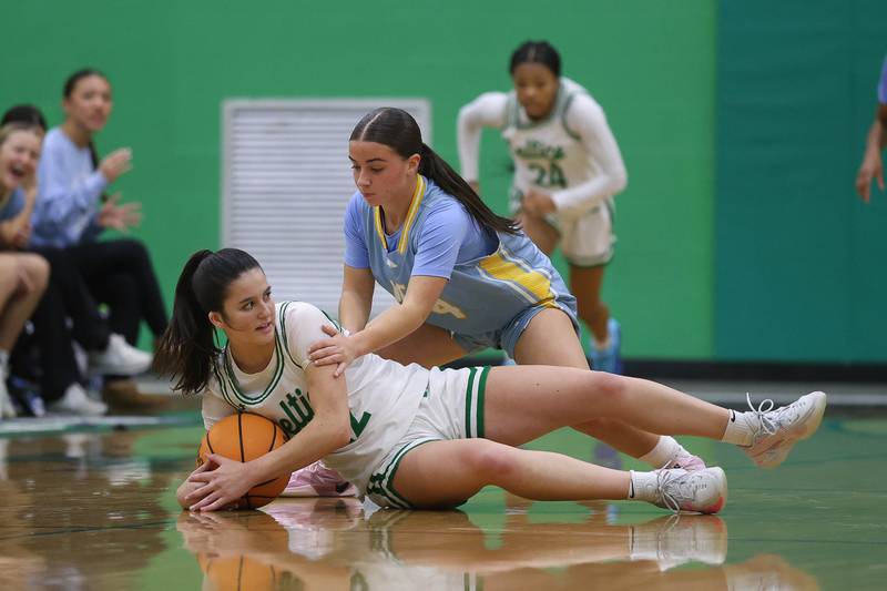 Providence’s Taylor Healy looks to pass under the pressure of Joliet Catholic’s Addison Farnaus on Saturday, Dec. 5, 2025 in New Lenox.