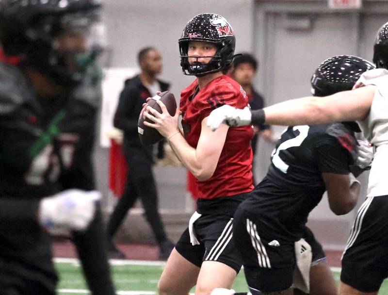 Northern Illinois quarterback Josh Holst, from Marengo, looks for a receiver during the first spring football practice Thursday, March 27, 2025, in the Chessick Practice Center at NIU in DeKalb.