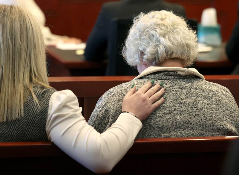 Sue Saari (right), the daughter of Patricia Wilson and sister of Robert Wilson is comforted Thursday, March 20, 2025, during the sentencing of Jonathan D. Hurst who was convicted of the 2016 Wilson murders. Hurst was sentenced to life in prison.