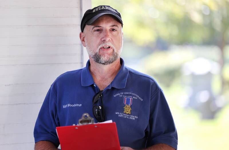 Volunteer Matt Woodstrup talks about the life of Arthur Kingpin, who was a township official who lived from 1909 to 1990, during the Etched in Stone cemetery walk Sunday, Oct. 9, 2022, at Elmwood Cemetery in Sycamore. The event, hosted by the DeKalb County History Center, told the stories of some local individuals who are buried there.