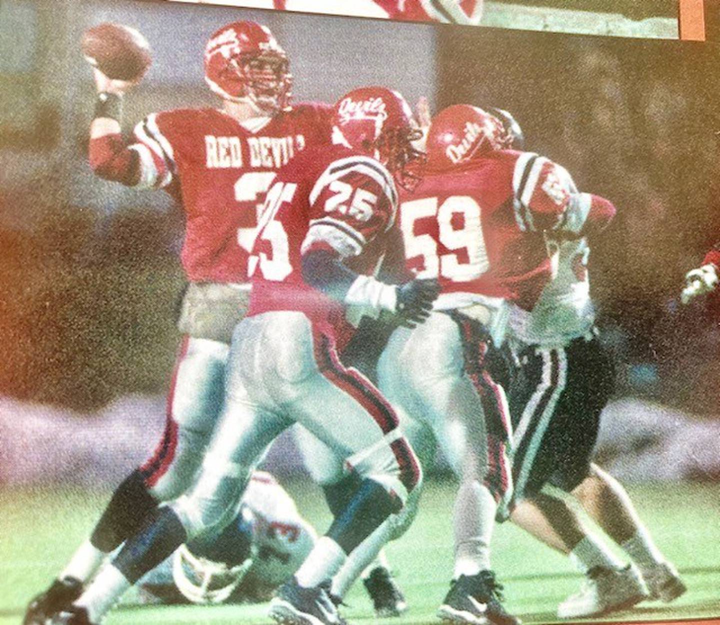 Hall quarterback Jeff Turigliatti throws a pass during the 1995 Class 3A state championship game in Normal.