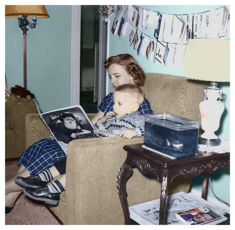 Betty Corlew of Joliet reads a story to her son Gary Corlew on Christmas Eve,1955.