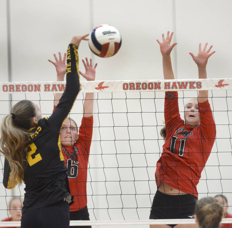 Erie-Prophetstown's Kaylee Keegan (6) and Laura Abbott (11) jump to block a spike by Lena-Winslow's Mia Diffenderfer during the third place match at the Oregon Varsity Girls Volleyball Tournament on Saturday, Sept. 6, 2025 at the Blackhawk Center in Oregon.