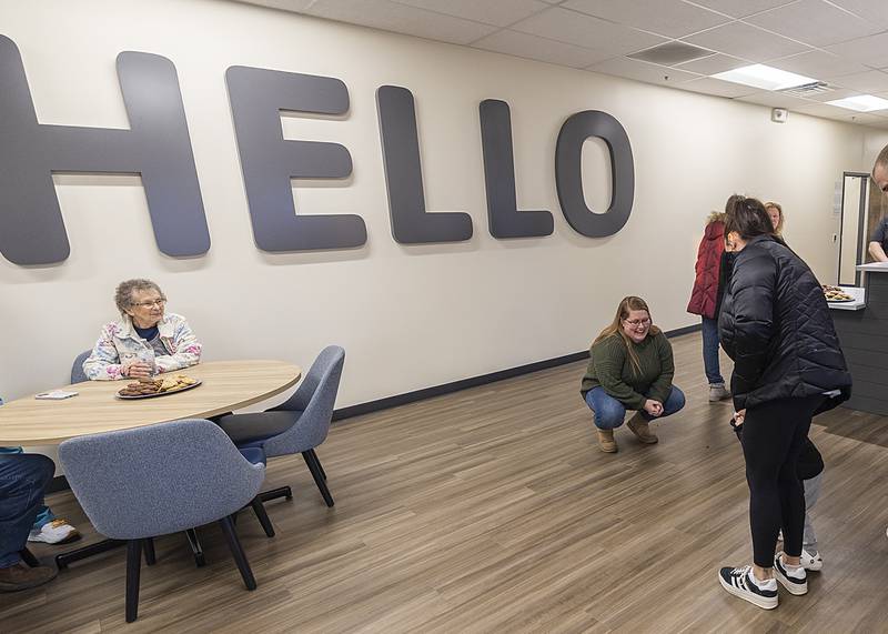 Dixon YMCA Child Care Center director Heather Grobe speaks with family members Thursday, Jan. 9, 2025, during an open house of the new facility. The center is close to opening.