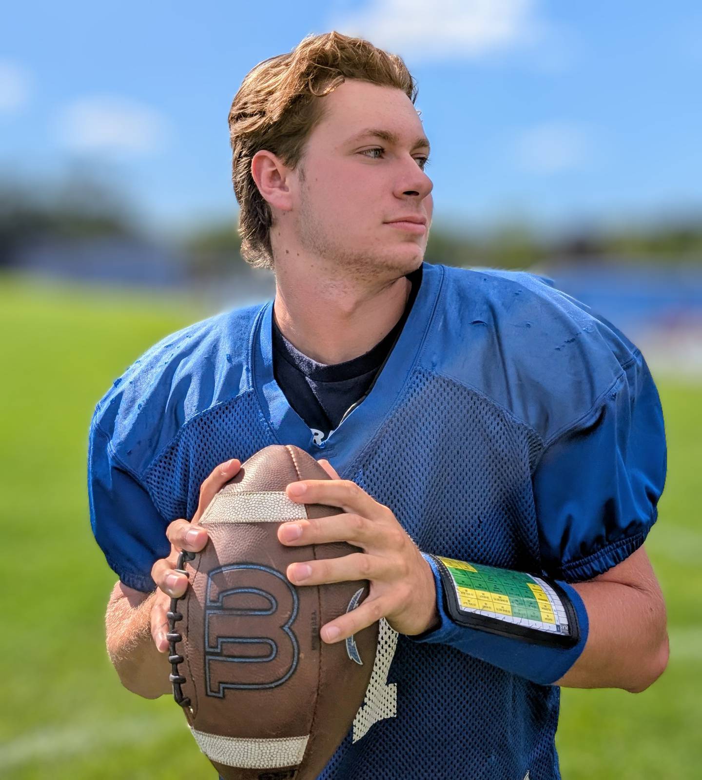 Woodstock senior quarterback Caden Thompson poses for a picture during practice Thursday, Aug. 21, 2025, at Woodstock. Thompson has been the Blue Streaks' starting QB since his sophomore year.