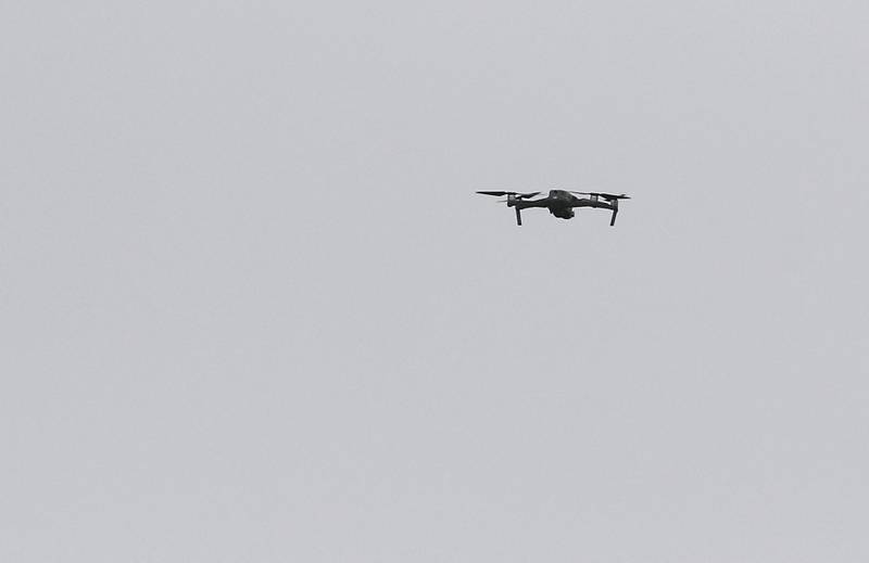 A drone flies overhead as officers from the McHenry County Sheriff and other departments investigate a domestic incident in which four people were killed on Wednesday Aug. 9, 2023, in the 5800 block of Wild Plum Road in unincorporated Crystal Lake. Police later said they were family members.