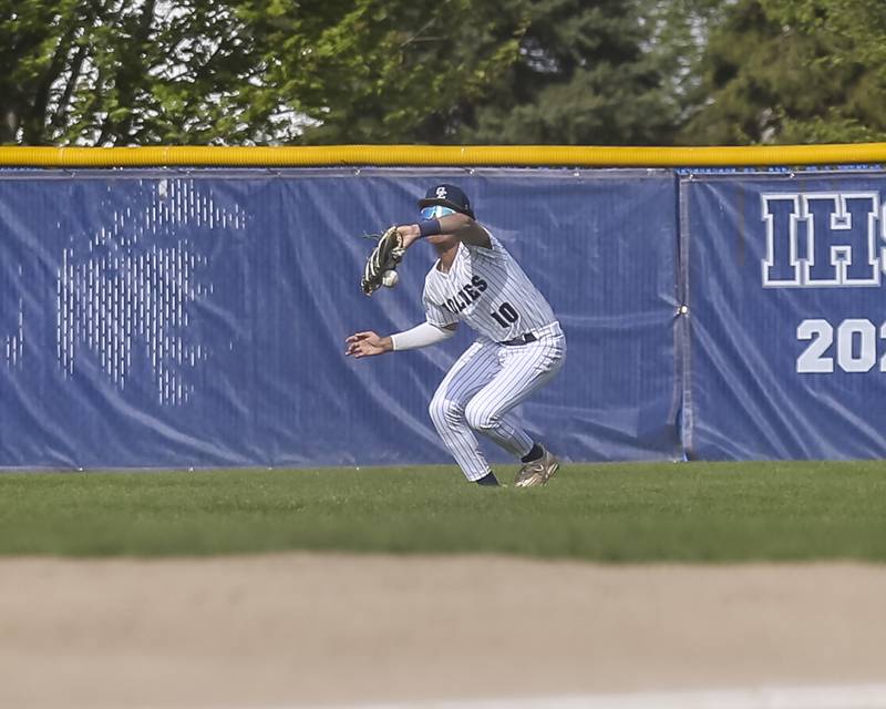 Oswego East's Wilson Terrutty (10) drops a flyball to center during baseball game between Plainfield North at Oswego East, Monday, April 28, 2025 in Oswego.