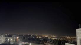 Booms and sirens in Israel after Iran launches ballistic missiles and drones in unprecedented attack